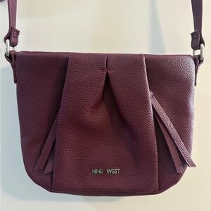 Nine West burgundy/purple crossbody purse like new.  Adjustable strap